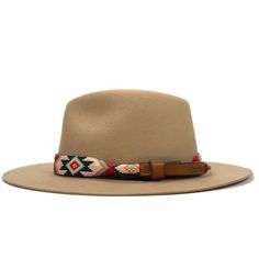 Price includes a Lola Sambboho hat & a Phoenix hatband. Save 10% with this bundle. Select hat size. Hatband is one size fits all. Hatband is removable. An iconic must-have Fedora hat that will never get out of fashion. Sambboho's Lola hat has a soft brim and indented crown. A chic piece to be worn at all seasons of the year. The timelessness chic and sophistication exuded by this hat make it a lifetime wardrobe investment you’ll never regret! Classic Fedora design in Sand color Trimmed with Full Native Patterns, Navajo Pattern, Beaded Hat Bands, Beaded Dog Collar, Leather Hat, Leather Hats, Beads Handmade, Vogue Magazine, Southern Charm