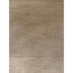 an area rug that is beige and has no pattern on it