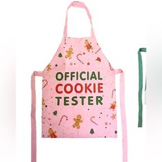 a pink apron that says official cookie tester with gingerbreads and candies on it