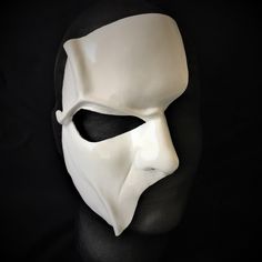 DESCRIPTIONHaunt the Paris Opera House Palais Garnier! You'll steal the stage in this extremely detailed white leather half-face mask is fabulous for theatre productions, masquerade balls, Mime costume or Halloween parties. Waterproofed, so fantastic for outdoor theater, Renaissance Festivals, or Burning Man. Any color. Waterproofed leather, glossy or matte finish, & several choices to affix the mask (cord, elastic, ribbon, waterproof cord, or no holes for adhesive). Measurements: 8" high x White Masks For Cosplay Events, White Eye Mask For Cosplay, White Full Face Mask For Cosplay Events, White Full Face Mask For Cosplay, White Masks And Prosthetics For Masquerade And Cosplay, White Venetian Masks For Theater, White Venetian Masks And Prosthetics For Theater, White Carnival Eye Mask, Venetian White Mask For Theater