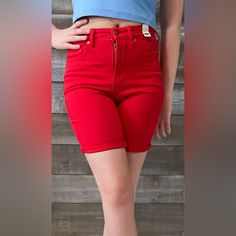 Judy Blue's Magic Tummy Control Now Available In Shorts! The Control Top Feature Is A Stretchy Panel Across Your Mid Section That Helps Keep Everything Tucked In And Smoothed Out, Giving You That Extra Boost Of Confidence To Wear The Shorts! These Red Garment Dyed Bermuda Shorts Are A Perfect, Bold Color That Will Look Great With A Colorful Tank And Sneaks For That Long Overdue Vacation! Or Break Them Out For Game Day Next Football Season With Your Favorite Team Tee Or Jersey! Also Available In Red Biker Shorts With Built-in Shorts, Red Cotton Bottoms With Built-in Shorts, High Waist Cotton Biker Shorts, Trendy Red High Waist Jean Shorts, Casual Red High-waist Bottoms, Red Casual Short Length Bottoms, Trendy Red Cotton Shorts, Red High-waisted Jean Shorts For Spring, Red High-waisted Cotton Shorts