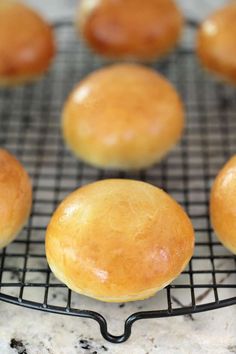 several baked goods are cooling on a wire rack