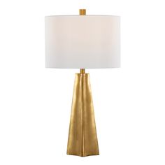 a gold table lamp with a white shade