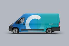 a blue delivery truck with the letter c on it's side is shown in front of a gray background