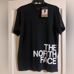 New Black North Face Short Sleeve Shirt. 100% Cotton Size Small. Standard Fit. The North Face On The Front With The Emblem On The Back. The North Face Crew Neck Top With Letter Print, The North Face Cotton Graphic Tee, The North Face Letter Print Streetwear Tops, The North Face Graphic Print Tops For Streetwear, The North Face Relaxed Fit Top For Streetwear, The North Face Black Tops With Letter Print, Black The North Face Tops With Letter Print, The North Face White Casual Tops, The North Face Black Casual T-shirt