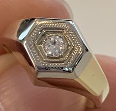 Do you love vintage jewelry? Are you looking for a ring that catches your eye without being too showy? This unique vintage 10kt yellow gold diamond ring may be exactly what you're looking for! It can be worn by both men and women. It features a .14ct old mine cut diamond in a polished yellow gold mounting with a white gold top. Ring size 7 1/2 (can be sized upon request) Please message with sizing questions. 5.0 dwt Vintage Signet Ring With Single Diamond For Formal Occasions, Vintage Signet Ring With Diamond Accents For Formal Occasions, Vintage Signet Ring With Diamond Accents For Formal Events, Vintage Formal Signet Ring With Diamond Accents, Vintage Diamond White Signet Ring For Formal Occasions, Classic Diamond Signet Ring Collectible, Collectible Classic Diamond Signet Ring, Vintage Diamond White Signet Ring, Antique Vvs Clarity Signet Ring For Anniversary