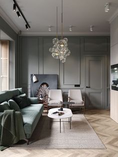 a living room filled with furniture and a chandelier