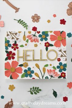 a card with flowers and the word hello on it