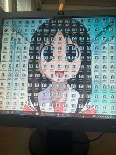 a computer screen with an image of a woman's face on the monitor screen