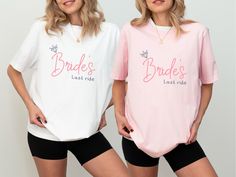 two women wearing matching bride's and last ride shirts