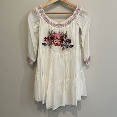 Nwt Xs Free People Ivory Sun Beams Embroidered Mini Dress! Second Owners. Purchased From Posh. Perfect Condition With Tags Still Attached. Smocked Of The Shoulder Neckline And Sleeve Cuffs. Floral Embroidery On The Front. Fully Lined. Embroidered White Long Sleeve Mini Dress, White Embroidered Long Sleeve Mini Dress, White Long Sleeve Embroidered Mini Dress, White Cotton Mini Dress With Floral Embroidery, Fitted Embroidered Off White Dress, Fitted Embroidered Off-white Dress, Fitted Off White Embroidered Dress, Spring White Mini Dress With Embroidered Hem, White Embroidered Hem Mini Dress For Spring