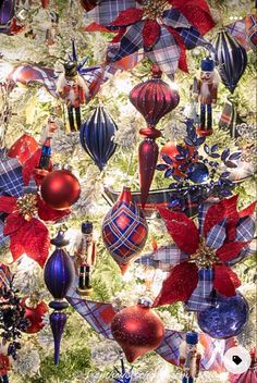 a christmas tree decorated with red, white and blue ornaments