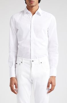 A smart wardrobe essential, this Italian-crafted shirt is cut from pure cotton poplin for a crisp look and easy movement. 30" length; 40 1/2" chest (size 40) Raised placket Point collar Long sleeves with button cuffs 100% cotton Machine wash, line dry Made in Italy Designer Clothing Cotton Poplin, Wardrobe Essentials, Pure Cotton, Button Up Shirts, Button Up, Top Shirt, Dolce And Gabbana, Nordstrom, Wardrobe