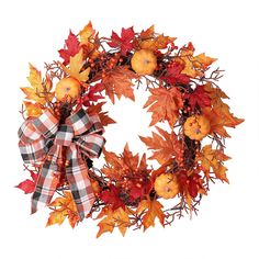 a wreath with apples, oranges and leaves is shown on a white background in this image