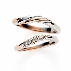 two wedding rings with diamonds on top of each other, one is white and the other is rose gold