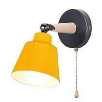 a black and yellow wall lamp with a white light on the side, attached to a chain