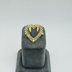 Elevate your style with our exquisite 20mm 10K Gold Rolex Style Heart Ring, a true testament to luxury and sophistication. Crafted with precision and attention to detail, this ring exudes timeless elegance. Ring is approx. 20mm wide and 19mm tall. Luxury Heart Shaped Diamond Cut Rings, Luxury Heart-shaped Diamond Cut Rings, Formal Gold Heart Ring With Diamond Cut, Luxury 14k Gold Diamond Ring For Valentine's Day, Luxury Heart Ring With Diamond Cut, Luxury 14k Gold Heart Ring For Formal Occasions, Luxury Diamond Cut Heart Ring, Gold Heart Ring With Diamond Cut Fine Jewelry, Heart-shaped Yellow Gold Rings For Formal Occasions