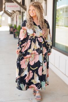 Chic Soul plus size clothing, black floral pattern maxi dress with crisscross neckline and a tie at the waist Chic Flowy Floral Dress For Brunch, Chic V-neck Floral Dress For Brunch, Chic Floral Print Maxi Dress For Brunch, Pink Flowy Midi Dress With Surplice Neckline, Chic Peach Floral Print Maxi Dress, Chic Peach Maxi Dress With Floral Print, Pink Floral V-neck Dress For Brunch, Chic Floral Print Midi Dress With Surplice Neckline, Chic Floral Midi Dress With Surplice Neckline