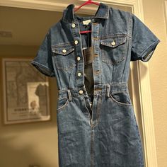 Cute Jean Dress. Never Been Worn, New With Tags. I’m 5’2 And It Fits More Like A Small. Fitted Medium Wash Mini Dress For Work, Medium Wash Fitted Dress With Short Sleeves, Fitted Denim Dress With Short Sleeves For Casual Wear, Fitted Dress With Pockets For Casual Wear, Fitted Dress With Pockets For Dress Down Occasions, Blue Fitted Denim Dress With Short Sleeves, Fitted Blue Denim Dress With Short Sleeves, Fitted Short Sleeve Dress With Pockets, Medium Wash Mini Dress For Workwear