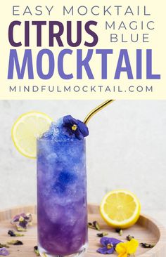 a purple drink with lemon and blue ice on a wooden tray that says easy mocko cocktail