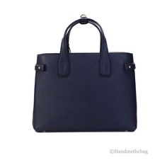 Style: Burberry Banner Medium Regency Blue Tote Crossbody Bag Material: Grainy Leather Features: Adjustable/Detachable Crossbody Strap, Inner Zip and Slip Pockets, Center Zip Compartment Divider, Protective Bottom Studs Measures: 13.25" L x 9.5" H x 6" D