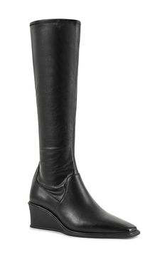 A sleek wedge heel enhances the streamlined silhouette of this contemporary knee-high boot fronted by a squared toe. 2" heel 16 1/4" shaft Side zip closure Leather upper and lining/synthetic sole Imported Modern Knee-high Boots With Stacked Heel, Vagabond Shoemakers, Knee High Wedge Boots, Black Wedge Boots, High Wedges, Black Wedge, Wedge Boots, Anniversary Sale, New Shoes