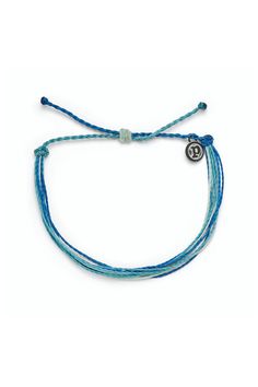 Deep Dive Bracelet by Pura Vida Pura Vida Bright Original Bracelet in the color Deep Dive It’s the bracelet that started it all. Each one is handmade, waterproof and totally unique—in fact, the more you wear it, the cooler it looks. Grab yours today to feel the Pura Vida vibes. DEETS: 100% Waterproof Wax-Coated Iron-Coated Copper "P" Charm Adjustable from 2-5 Inches in Diameter Final Sale - No Returns or Exchanges Founded in Costa Rica, Pura Vida Bracelets provides sustainable jobs to artisans w Dove Bracelet, Costa Rica Pura Vida, Vida Blue, Xmas Wishlist, Preppy Bracelets, 2024 Wishlist, Preppy Jewelry, Summer Christmas, Pura Vida Bracelets