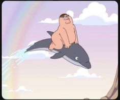 a cartoon character riding on the back of a dolphin with a rainbow in the background