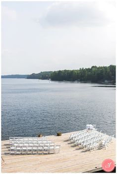 chairs are set up on the dock for an outdoor ceremony