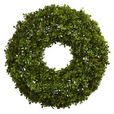 a round boxwood wreath on a white background