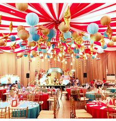 an elaborately decorated banquet hall with red, white and blue decorations on the ceiling