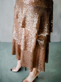 The Butterscotch Sequin Midi Skirt is party perfection with its layers of rich butterscotch-colored sequin fabric. The style has a slight a-line silhouette and features an elastic waistband. Pair with a cozy knit for your next date night. Sequin Midi Skirt, Cozy Knit, Sequin Fabric, Cozy Knits, Date Night, Sequin Skirt, Midi Skirt, Sequin, A Line