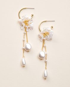 "MORENA DANGLE EARRINGS  Our Morena Dangle Earrings are designed to be one-of-a-kind floral dangle hoops that will have everyone asking \"where did you get those?!\" Crafted with off white flower clusters & dangling freshwater pearl beads, these earrings are perfect for casual or formal wear. DETAILS * Freshwater pearls, off white flowers, & pearl-like beads * Measures 1\" x 3.25\" length * Hypoallergenic, lead-free & nickel-free * Style #4389 SHOP MORE STYLES https://www.etsy.com/shop/darethcol White Pearl Drop Clip-on Earrings For Wedding, White Teardrop Hoop Earrings For Wedding, White Hoop Earrings For Celebration, Delicate White Hoop Earrings For Wedding, Delicate White Dangle Chandelier Earrings, White Teardrop Flower Earrings For Wedding, White Pearl Drop Jewelry For Marriage, White Pearl Drop Clip-on Earrings For Anniversary, Delicate White Hoop Earrings For Formal Occasions