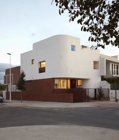 a large white building sitting on the side of a road