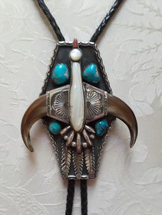 "A large Sterling silver native American turquoise large Thunderbird bolo. This artist made stunning unique bolo weighs 175.5 grams and measures 5\" long and 4\" at the widest point. The center of the thunderbird is mother of pearl (shell) and the beke is coral. The beautiful natural larger turquoise measures approx 16mm and smaller ones approx13mm. This piece is a old pawn bolo from the 50's-60's or could be earlier and is in excellent condition. The wing portion is claw. This bolo is a beautif Gothic Rock Fashion, Naja Necklace, Claw Jewelry, Jewlery Rings, Bear Claw, Wallpaper Earth, Bear Claws, Rock Fashion, Gothic Rock