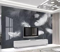 a modern living room with black and white wallpaper, an entertainment center and coffee table