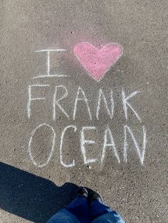 i love frank ocean written in chalk on the ground with someone's feet standing next to it