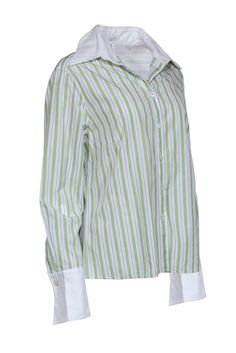 Get a crisp, clean classic with this structured cotton blouse from Escada! Made with a timeless cotton in a menswear-inspired design, with the classics green pinstripe design this is the perfect polished piece to wear with wide leg pants and chunky loafers for your next business meeting, or get a bit dreamy with a soft knit skirt. Size 14 (DE 44) 100% Cotton Front button closures Unlined V-neckline with peak lapel collar Long sleeve with flared cuffs Fitted silhouette Stripped print Bust 44" Wai Classic Pinstripe Blouse For Spring, Pinstripe Cotton Blouse For Work, Striped Cotton Blouse With Button Cuffs, Classic Formal Blouse With Striped Collar, Classic Green Shirt For Work, Classic Striped Blouse With Relaxed Fit, Classic Pinstripe Cotton Blouse, Classic Pinstripe Collared Blouse, Classic Green Blouse For Work