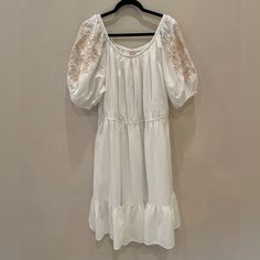 Beautiful Beige Embroidery On The Sleeves, Also Has Side Pockets And A Skirt Lining. White Embroidered Hem Dress For Daywear, White Embroidered Dress For Daywear, White Cotton Peasant Dress For Spring, White Peasant Dress For Spring, White Peasant Embroidered Dress, White Peasant Dress With Embroidered Hem, White Peasant Dress With Floral Embroidery, Beige Embroidery, Red Rose Dress