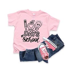 Looking for a cute tee for your kids? We have the perfect 100 Days Of School graphic tee addition to their closet! Also available in youth tees. Playful Cotton T-shirt For Back To School, Fun T-shirt For Back To School, Playful Graphic Print Tops For Back To School, Fun Cotton T-shirt For End Of School Year, Graphic Tee With Funny Print For School Year-end, End Of School Year Funny Print Graphic Tee, Playful School T-shirt With Funny Print, Playful Graphic Print T-shirt For School, Cute Text Print T-shirt For Back To School