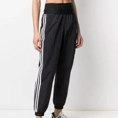 Nwot Adicolor Classics Double-Waisted Fashion Track Pants S From Sport To Hip Hop To High Fashion, The Track Suit Has Come A Long Way. No Wonder It’s Become A Wardrobe Staple. These Adidas Pants Build On That Shiny Waistband. The Recycled Nylon Plain Weave Feels Smooth Against Your Skin. This Product Is Made With Primegreen, A Series Of High-Performance Recycled Materials. Details Regular Fit High-Rise Elastic Waist 100% Recycled Nylon Plain Weave Shiny Waistband Front Pockets Back Pocket Elasti Black Bottoms With Waistband For Spring, Casual Black Pants With Logo Waistband, Sporty High-waisted Pants, Fitted Adidas Black Bottoms, Black Athleisure Pants With Logo Waistband, Sporty Bottoms With Logo Waistband For Spring, Casual Black Bottoms With Logo Waistband, Black Bottoms With Side Stripes For Spring, Spring Black Bottoms With Side Stripes