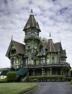 an old victorian house is shown on the screen, and there are clouds in the sky