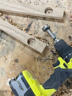 a cordless drill and two pieces of wood