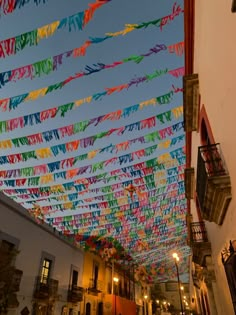 many colorful streamers are hanging from the ceiling