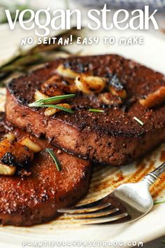 two steaks on a plate with a fork and knife next to it that says vegan steak no setian easy to make