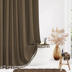 a bathroom with a bathtub, rug and brown shower curtain in front of a window