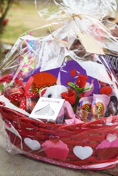 a basket filled with lots of different types of candy and candies on top of a table