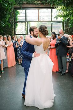 a bride and groom sharing their first dance