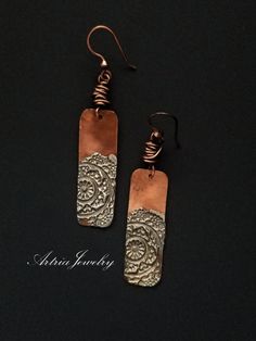 "These Copper Bar Earrings with Silver Solder Mandalas are a great pair of mixed metal earrings. Accented with copper wire knots. These earrings are part of our Mandala Collection. Sterling Silver Earwires Mandala Pendant/Necklace is available at - https://www.etsy.com/listing/1146736586/mandala-stamped-silver-solder-copper-bar?click_key=633ba3534eaf06a06972618af41db3e2122b0e08%3A1146736586&click_sum=1ecac27d&ref=shop_home_active_1  Mandala in Sanskrit is the term for the universe. Mandalas are Handmade Rectangular Copper Earrings, Rectangular Copper Earrings With Ear Wire, Handmade Rectangular Metal Earrings, Sheet Metal Jewelry, Mandala Earrings, Hammered Jewelry, Copper Bar, Mixed Metal Earrings, Bar Earrings