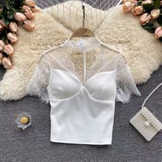 Lace halter neck top, hollow through short sleeves slim bottom shirtMaterial:blendedStyle:sexyFeatures:lace,see shroughColor:black,whiteSize(cm):free 1inch=2.54cmlength:43,bust:60-94,waist:60-84&ltp&gtNote:Due to different measurement methods,there will be 1-3 error(unite:cm), please understand.</p>&ltbr/> White Hollow Out Top For Party, Chic Hollow Out Tops For Night Out, White Hollow Out Fitted Tops, Summer Lace Patchwork Short Sleeve Top, Elegant Short Sleeve Party Crop Top, Elegant Short Sleeve Crop Top For Party, Summer Lace Patchwork Short Sleeve Blouse, Elegant Summer Lace Crop Top, Summer Blouse With Lace Patchwork And Short Sleeves